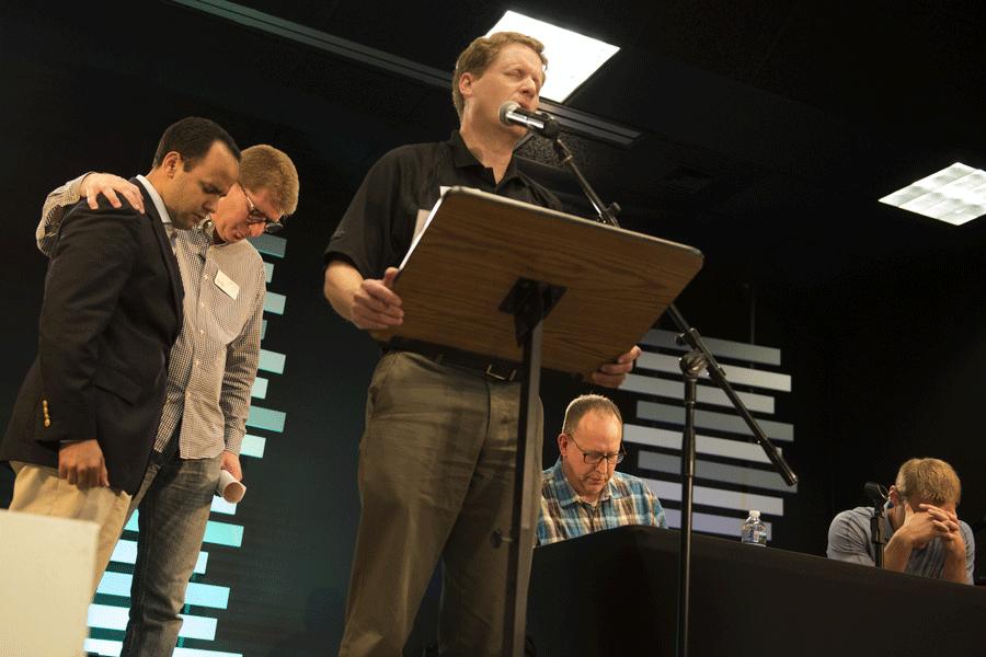 Andy Davis (center), chairman of IMB trustees’ mobilization and training committee, offers a prayer of blessing after the affirmation of Edgar Aponte (left) as IMB’s vice president of mobilization. Davis is senior pastor of First Baptist Church, Durham, North Carolina. Also pictured are trustees Jeff Long and Scott Harris, and IMB President David Platt. (IMB Photo by Roy M. Burroughs)