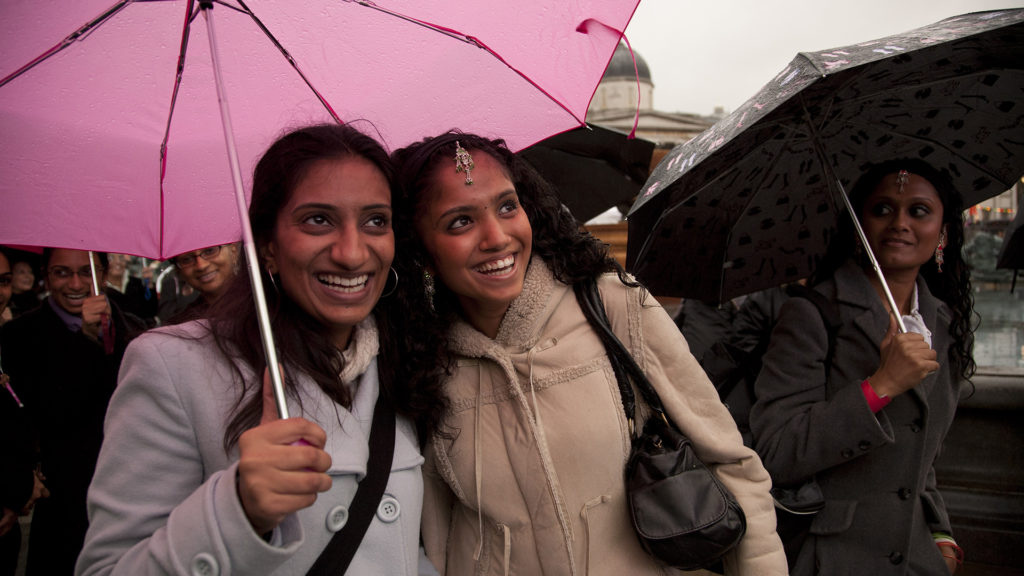 Girls celebrate ‘Diwali on the Square’ even in the rain in London's Trafalgar Square. Hindus, Sikhs, and Jains celebrate Diwali, the Festival of Light.