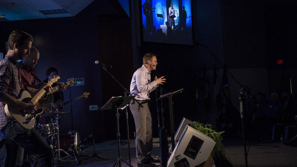 David Platt, IMB president, leads 26 new missionaries in a time of prayer during their missionary appointment service Feb. 23 in Richmond, Va. The service was broadcast via livestream to several thousand viewers. (IMB Photo by Warren F. Johnson)