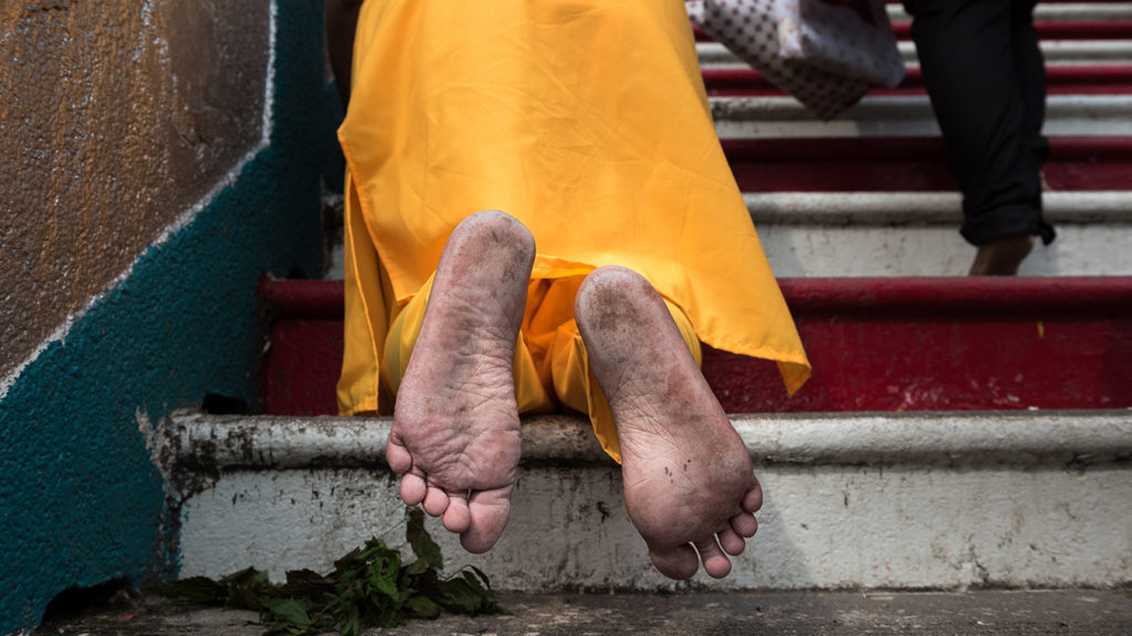 Many worshippers at Thaipusam make the pilgrimage barefoot.