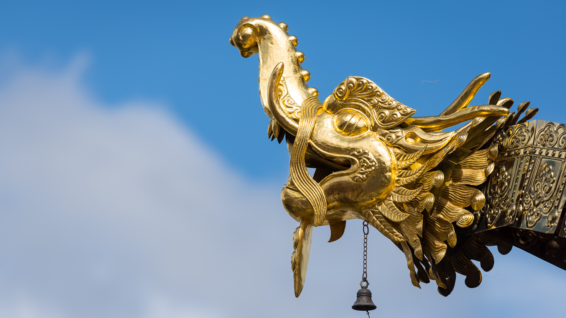 A gold dragon head decorates the roof of Tibetan temple in Shangri-La.