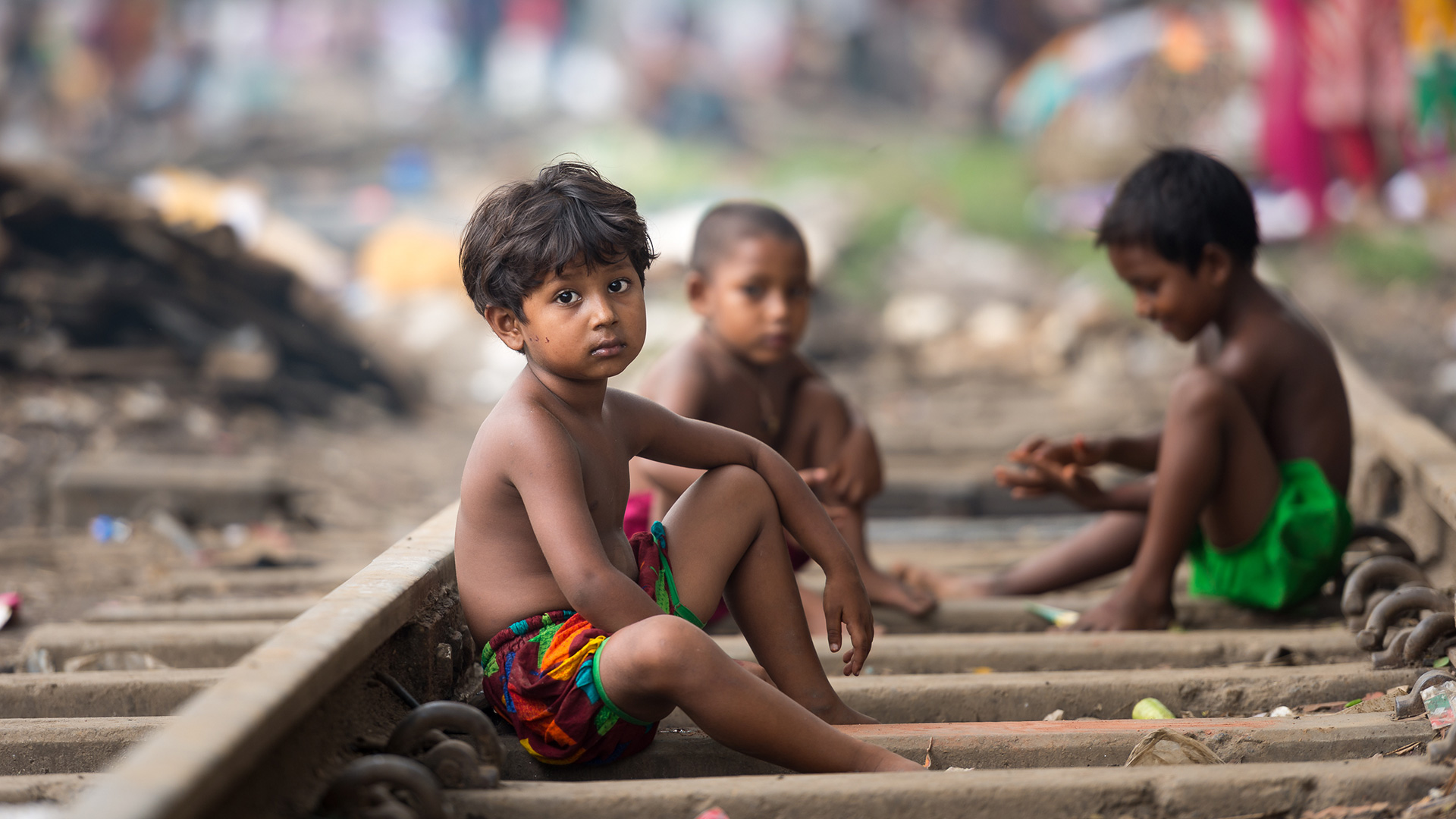 Thousands of Bangladeshis live along the railroad tracks.
