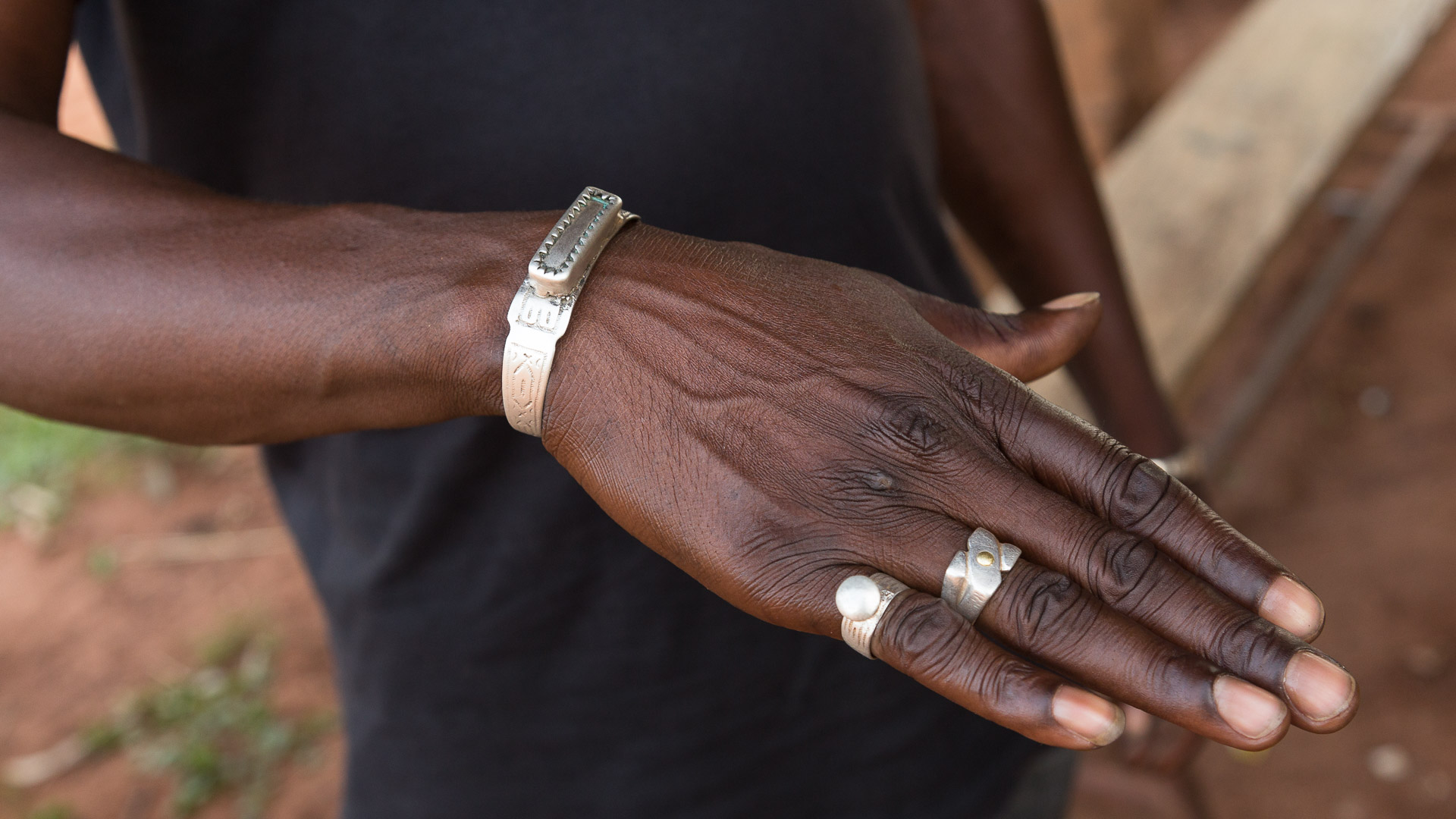 A Senufo man in Burkina Faso shows off his magical jewelry. 