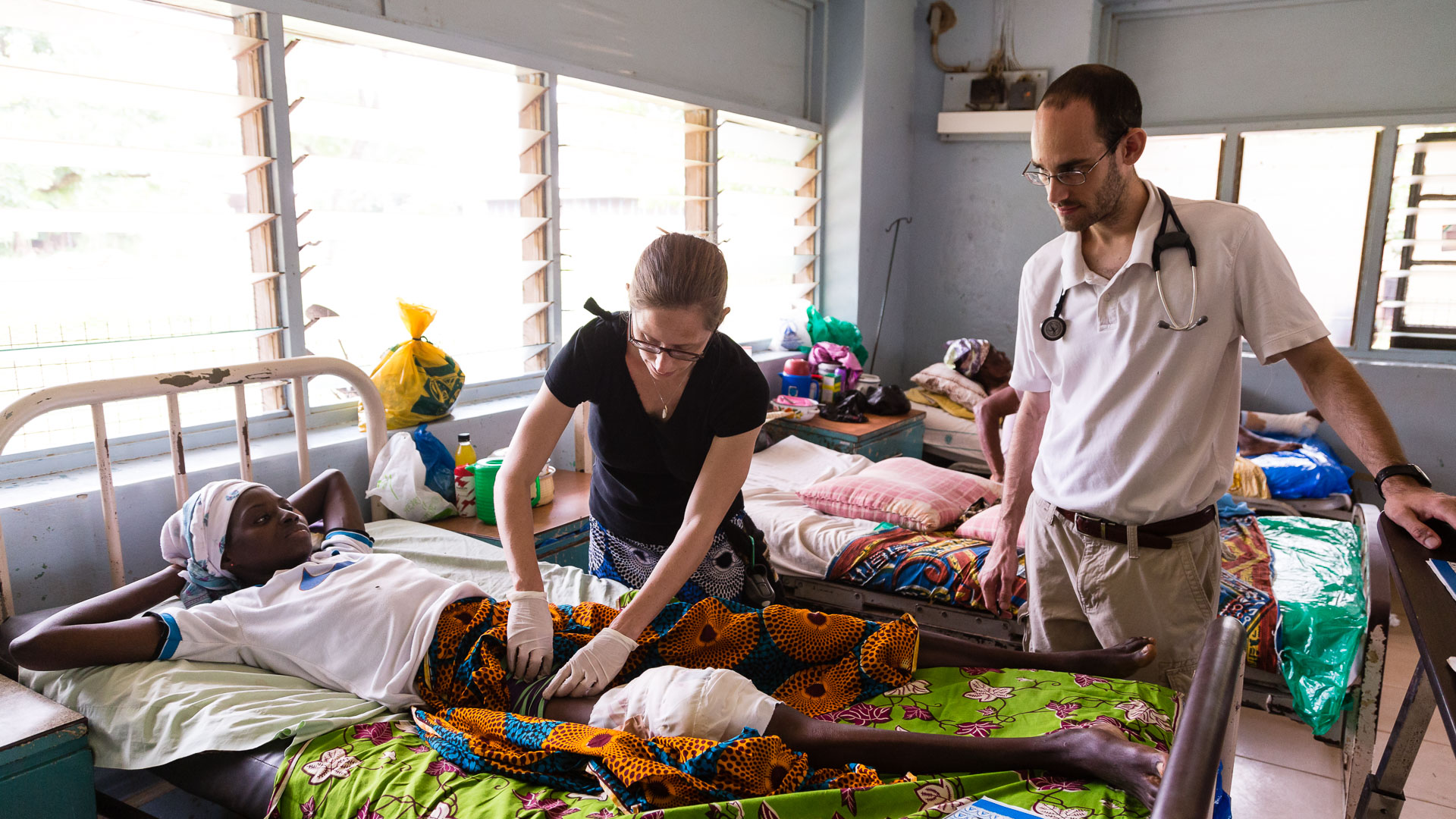 An IMB surgeon ministers to patients in West Africa.