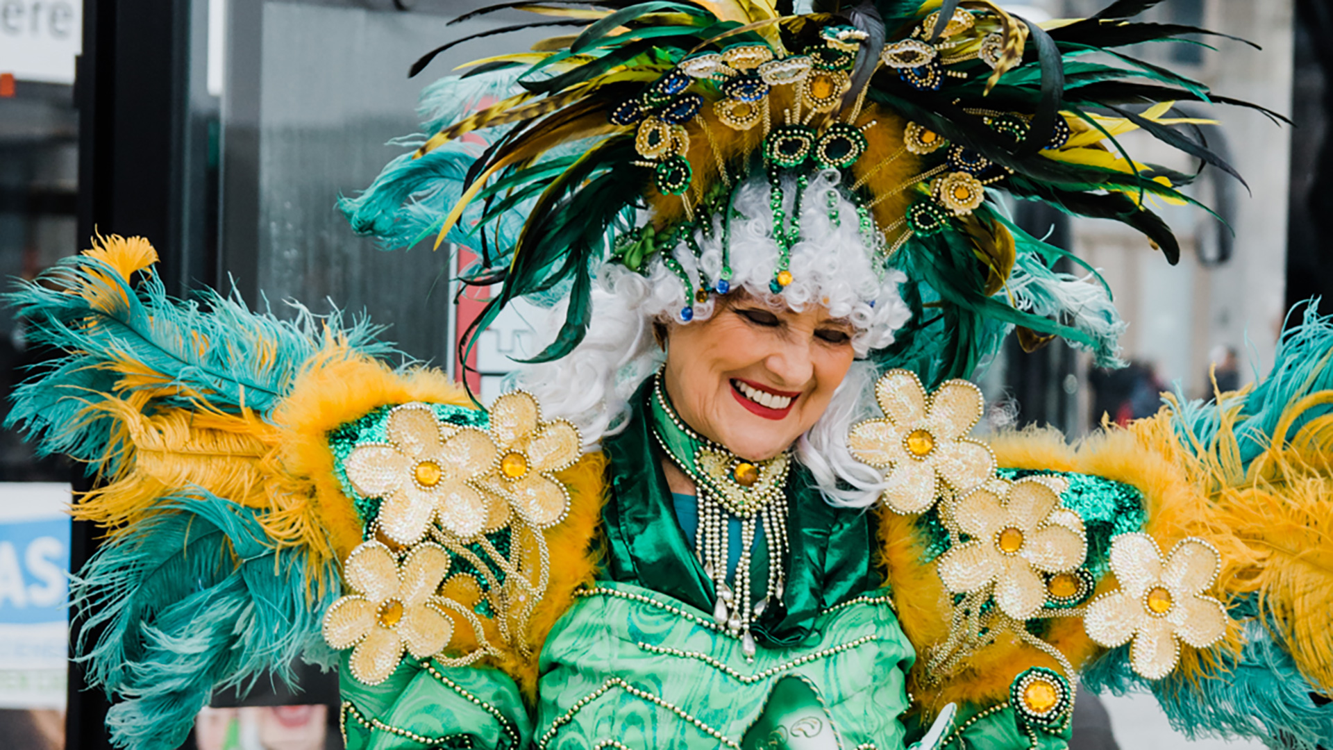 A woman in an elaborate green and gold costume. 