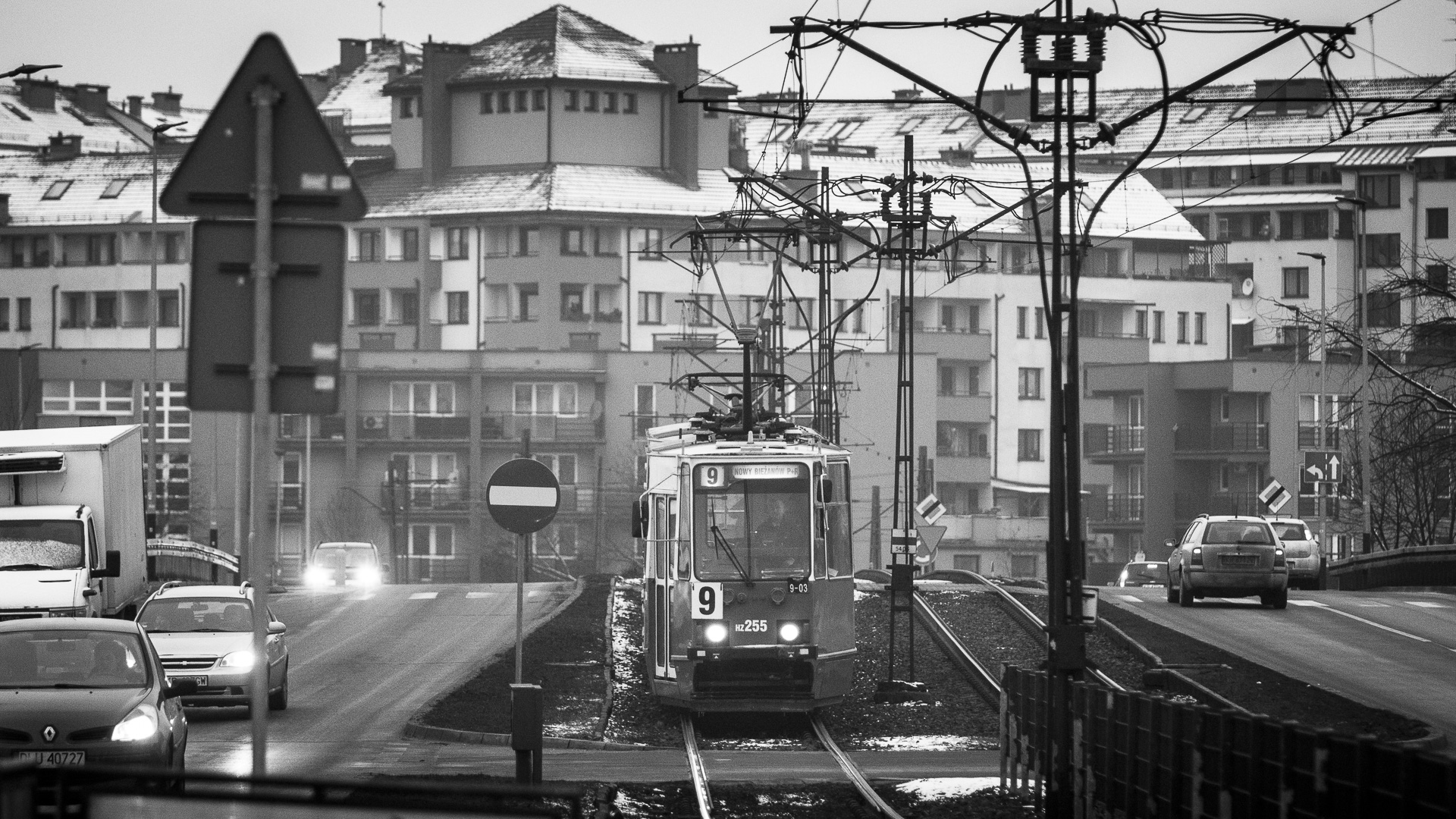 A tram arrives at a stop in Nowa Huta. 