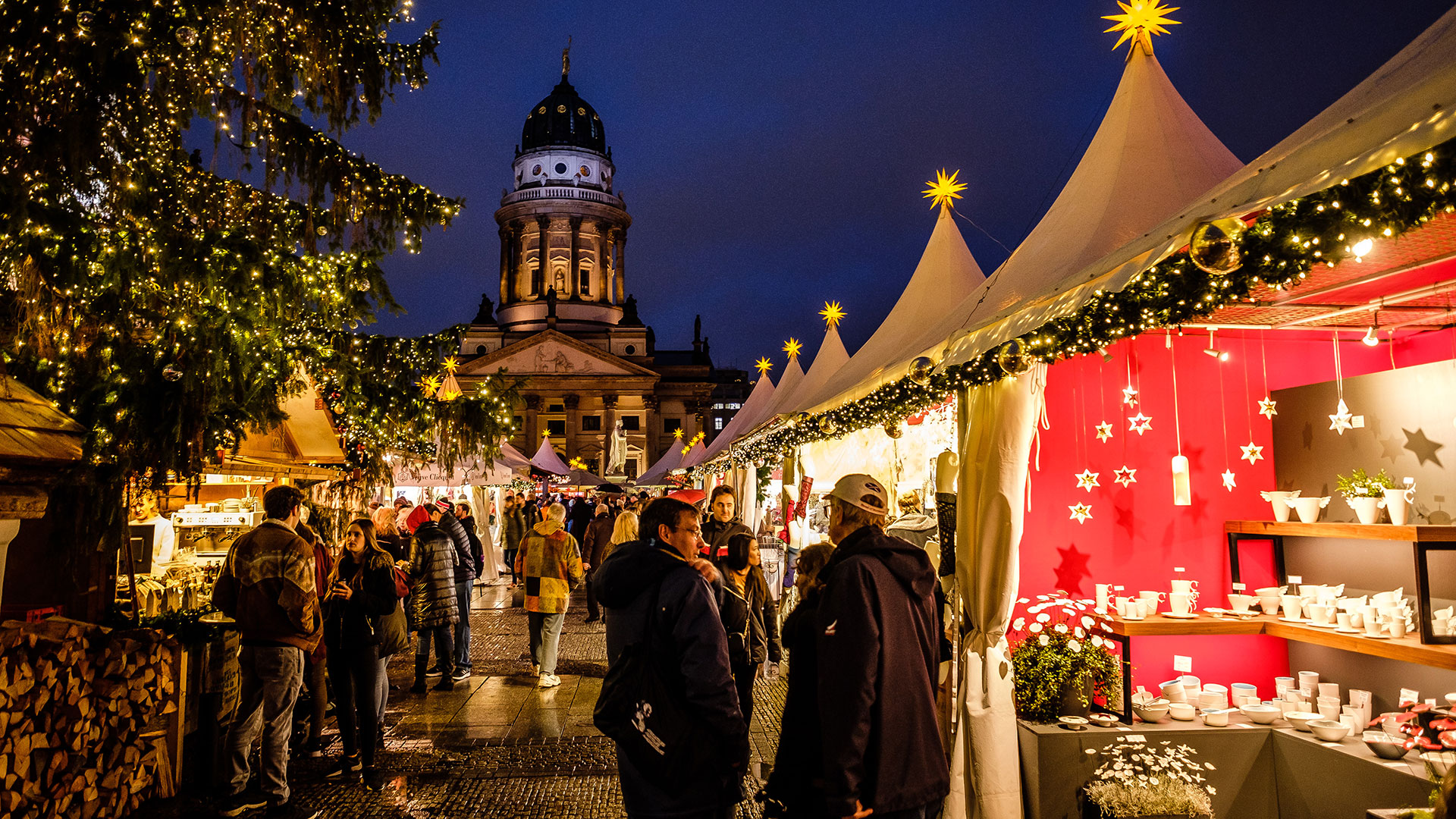 Shoppers browse the stalls at a Christmas market in Germany.
