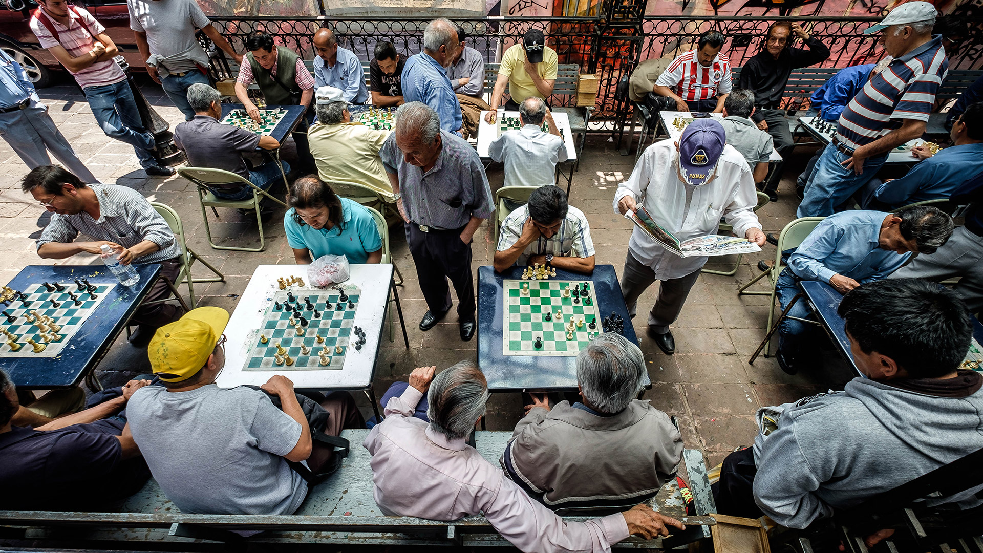 Men congregate in a historic neighborhood in Mexico City to compete in chess.