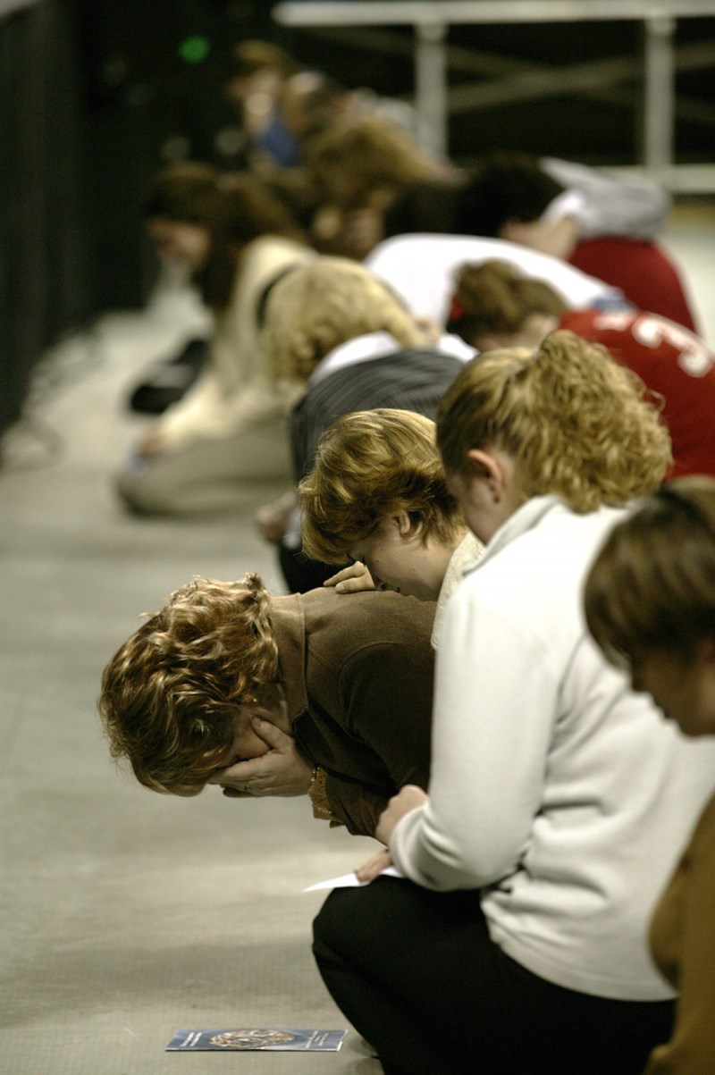 Baptists Praying at a Missions Events