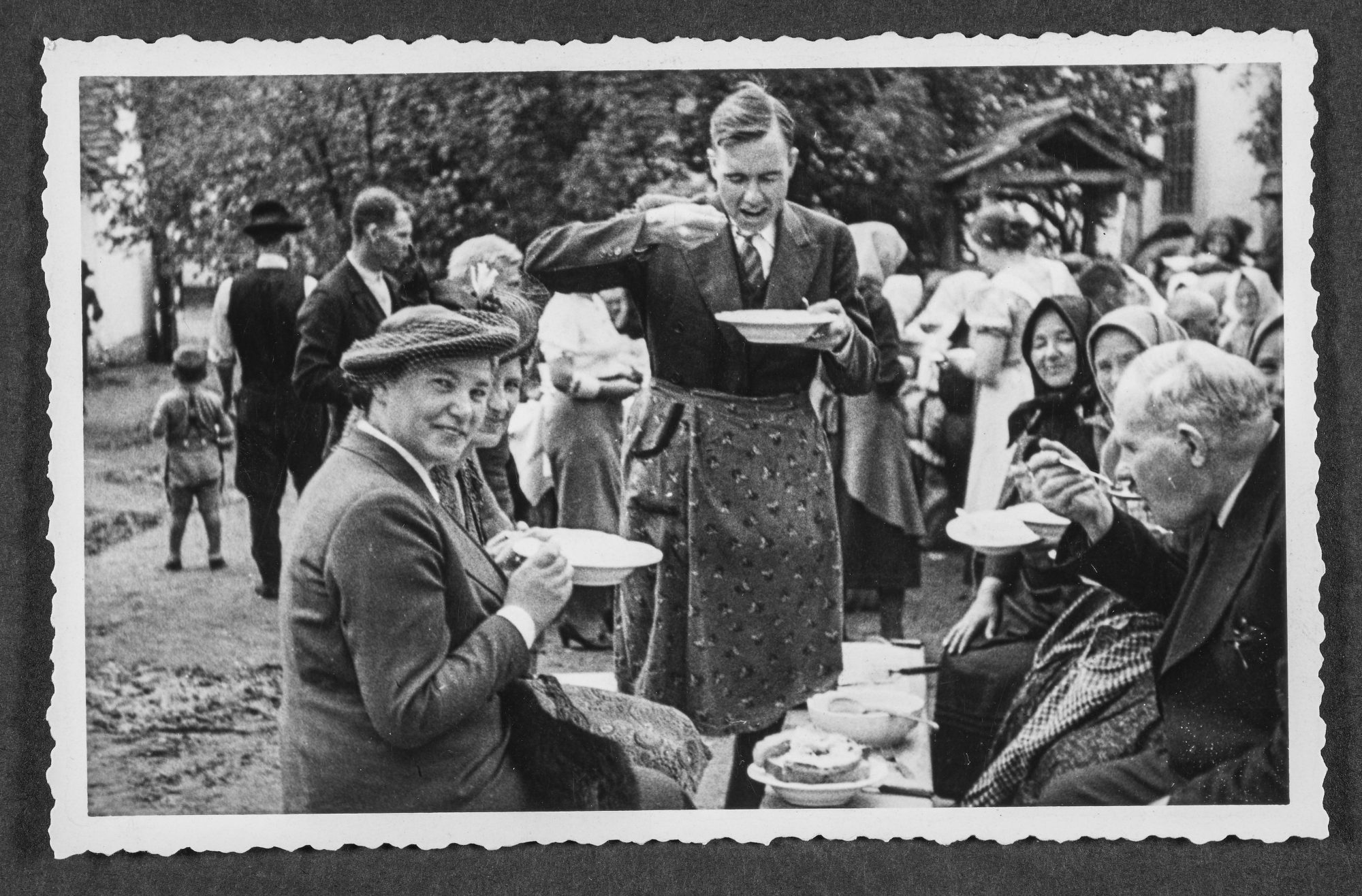 John Allen Moore dines on soup during a young peoples’ conference in Cerna, Yugoslavia, in 1939.