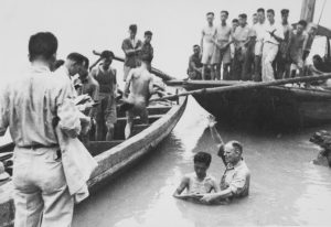 John Abernathy baptizes cadets in the Chialing River.