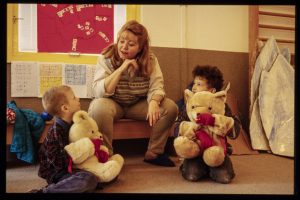Vesta teaches sign language at a school for Deaf children — teddy bears help them learn signs.