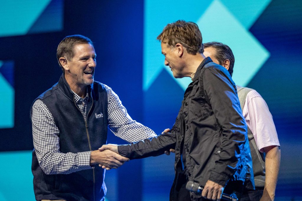 IMB President Paul Chitwood greets Michael W. Smith on stage at the 2021 Send Conference in Nashville, Tennessee, with NAMB President Kevin Ezell. Smith opened the event by leading worship for the nearly 10,000 people gathered. (IMB photo)