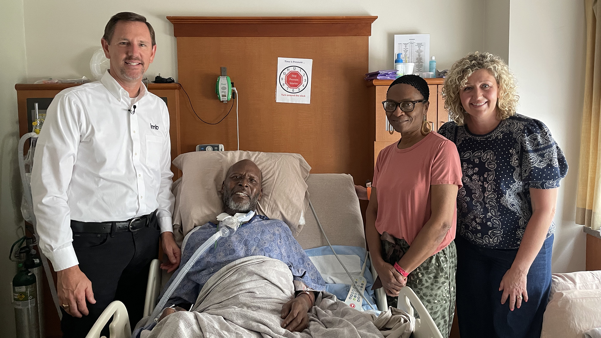 IMB President Paul Chitwood and his wife, Michelle, visit George Smith and his wife, Geraldine, in the hospital. George Smith contracted COVID while on the mission field in Uganda.