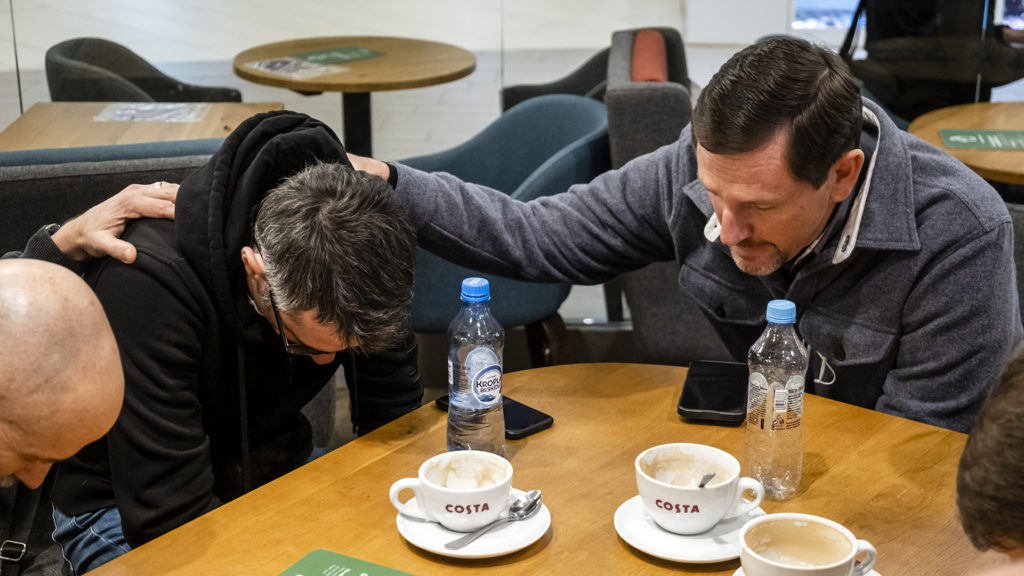 IMB President Paul Chitwood and missionaries pray with Ukrainian Baptist pastor and church planter Anatoliy Shmilikhovskyy after a meeting discussing strategies for getting quick and effective aid from Southern Baptists to Ukrainian refugees and internally displaced peoples. IMB Photo