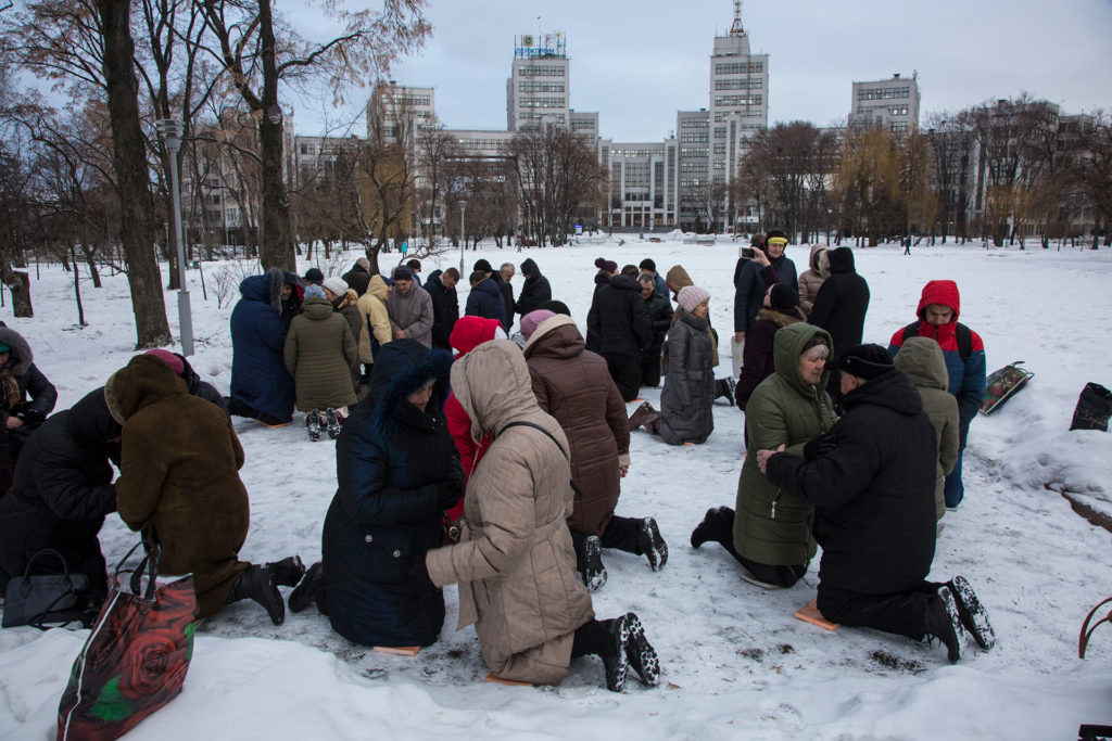 On Our Knees – Ukrainians kneel in 2019 and pray in the snow in Kharkov's city square. IMB Photo