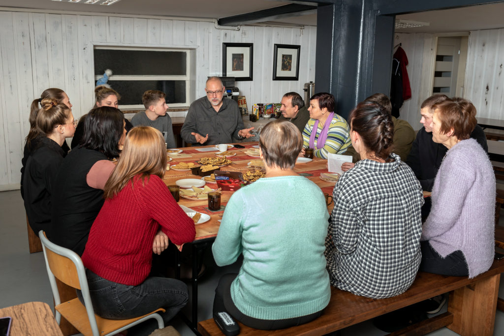 IMB missionary Dan Upchurch leads a Bible study for Ukrainian refugees in a Polish Baptist Church. The church has been actively involved in meeting the needs of refugees. Upchurch shares 2 Corinthians 4:9-10 and talks about how God does not leave his people in times of persecution. IMB Photo